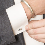 Model Wearing Pangolin Scale Cufflinks in Sterling Silver and Pangolin Armour Bangle in Sterling Silver