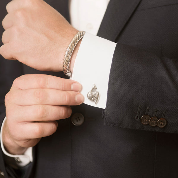 Model Wearing Guinea Fowl Cufflinks in Sterling Silver and Pangolin Armour Bangle in Sterling Silver