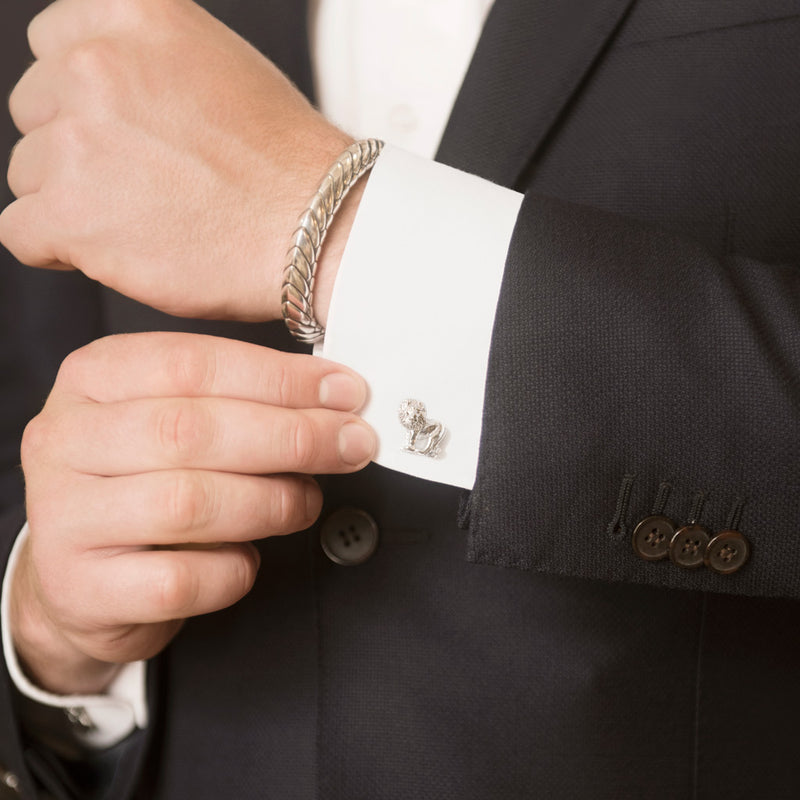Model Wearing Lion Cufflinks in Sterling Silver and Pangolin Armour Bangle in Sterling Silver