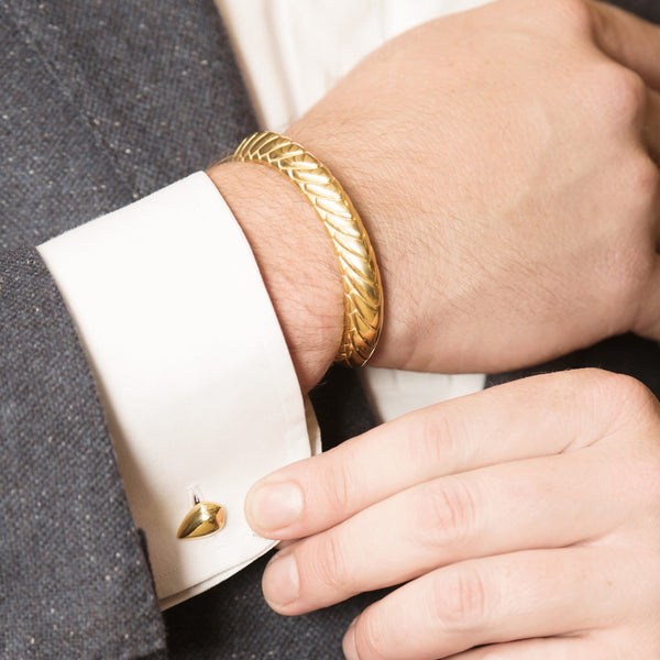 Model Wearing Pangolin Scale Cufflinks in 18ct Gold and Pangolin Armour Bangle in 18ct Gold