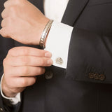 Model Wearing Rhino Cufflinks in Sterling Silver and Pangolin Shield Bangle in Sterling Silver