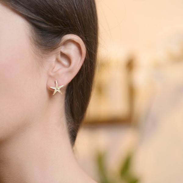 Model Wearing Starfish Stud Earrings in 18ct Gold
